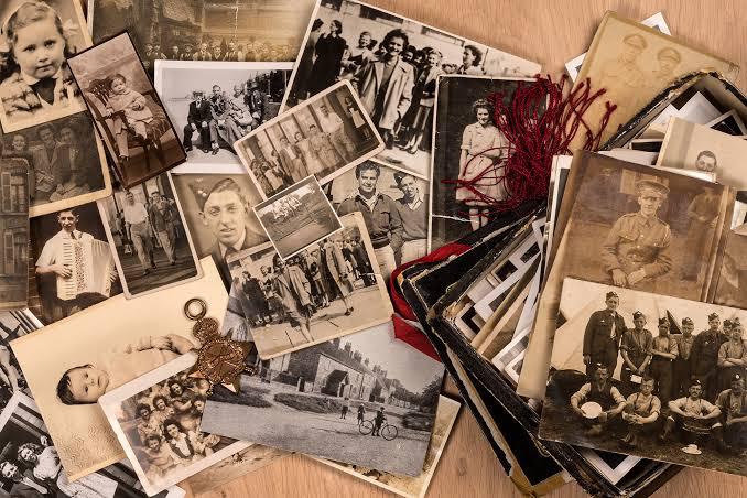 A pile of old printed photographs, the shoebox every family keeps
